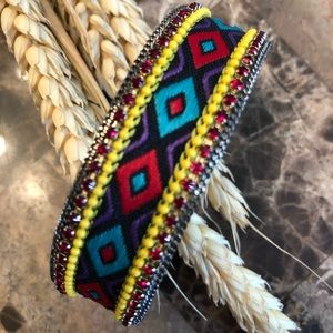 Gold toned cuff bracelet with rhinestones
